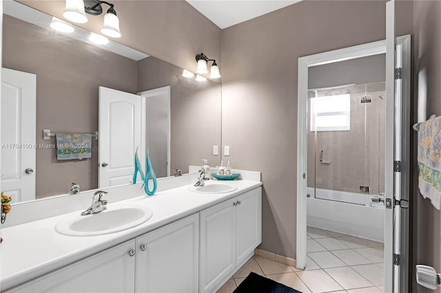 bathroom featuring tile patterned floors, tiled shower / bath combo, and vanity