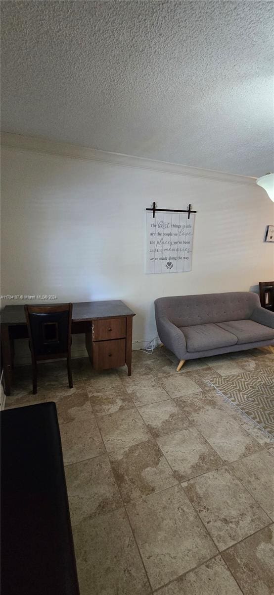 sitting room featuring a textured ceiling