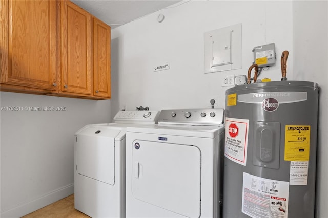 washroom featuring cabinets, water heater, electric panel, washer and clothes dryer, and light tile patterned floors