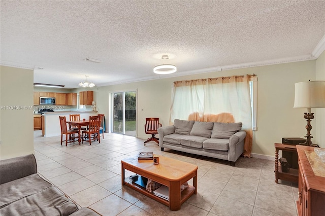 living room featuring light tile patterned floors, a textured ceiling, and ornamental molding