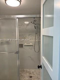 bathroom with an enclosed shower