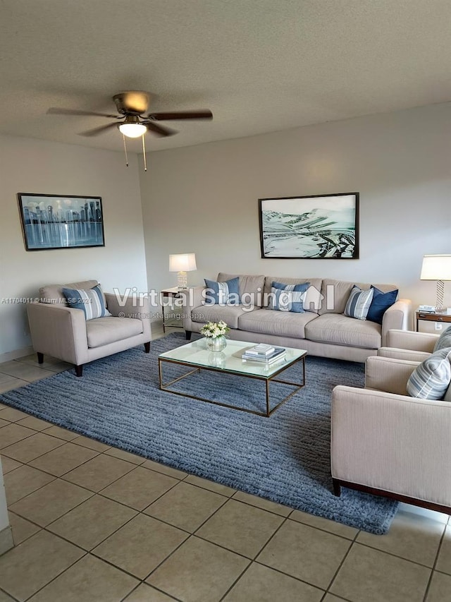 tiled living room with a textured ceiling and ceiling fan