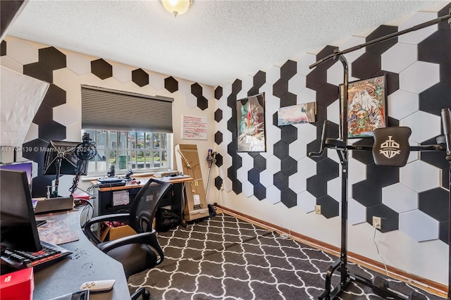 office featuring dark colored carpet and a textured ceiling