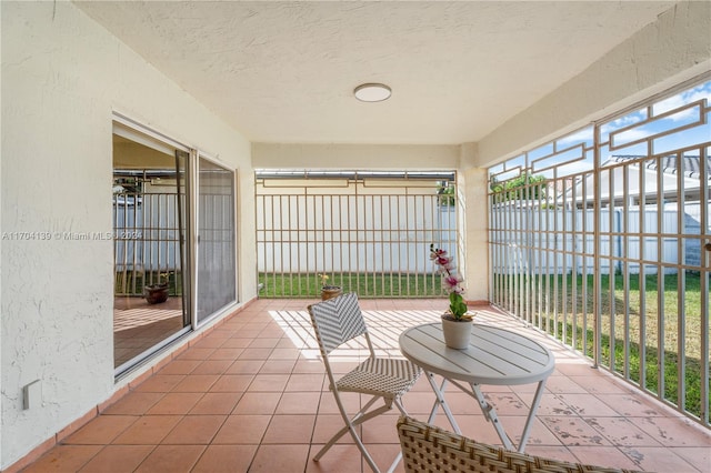 view of patio featuring a balcony