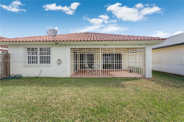 back of house with a yard