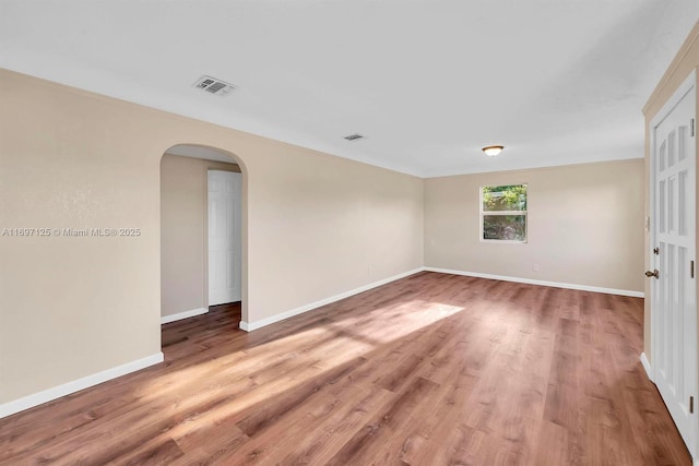 empty room featuring wood-type flooring