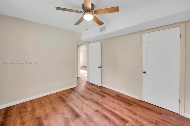 unfurnished bedroom with ceiling fan and light hardwood / wood-style flooring