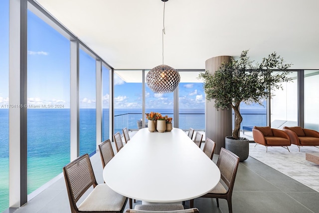 sunroom / solarium with a water view