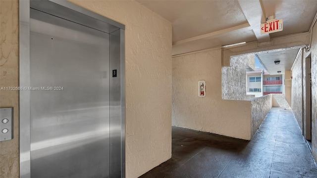 hallway featuring elevator