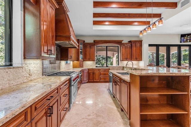 kitchen featuring hanging light fixtures, decorative backsplash, sink, and stainless steel appliances