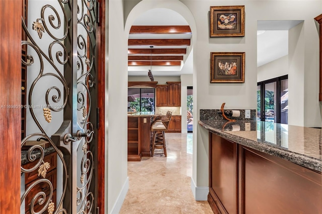 entrance foyer with beam ceiling