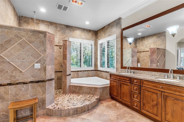 bathroom featuring vanity, separate shower and tub, ornamental molding, and tile walls