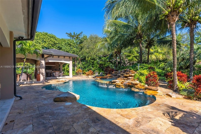 view of swimming pool with a patio area and pool water feature