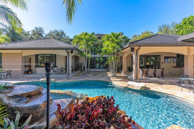 view of swimming pool featuring a patio area