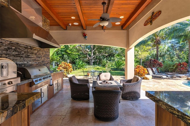 view of patio / terrace featuring area for grilling, grilling area, and ceiling fan