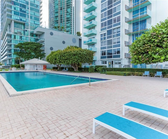 3301 NE 5th Ave Unit 110, Miami, FL 33137 - community pool featuring a patio area