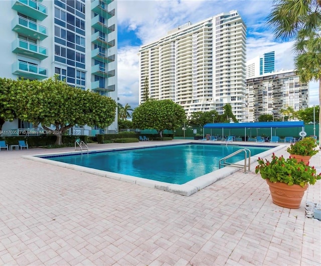 view of swimming pool featuring a patio