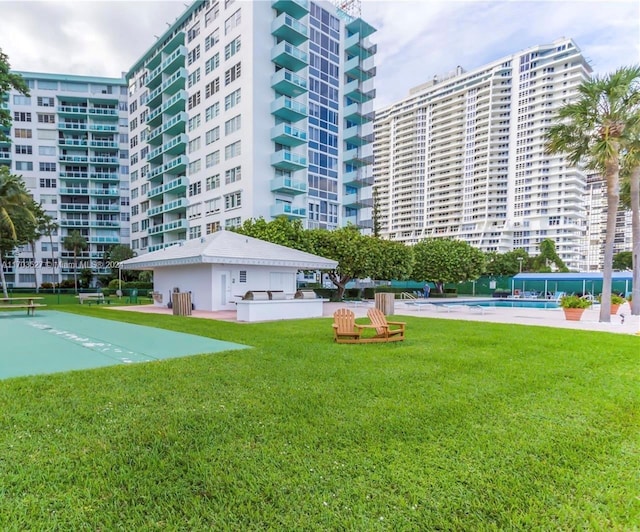 view of building exterior featuring a community pool