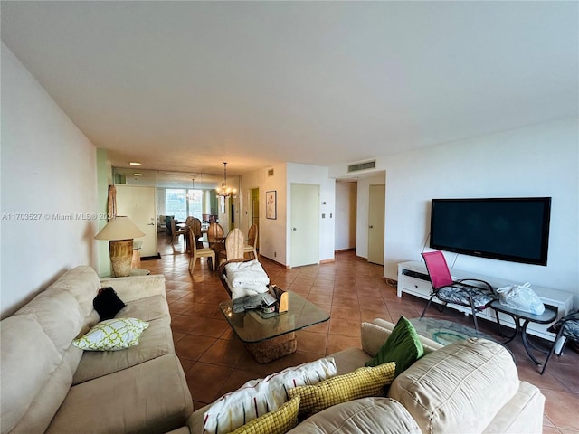 3301 NE 5th Ave Unit 110, Miami, FL 33137 - tiled living room with a chandelier