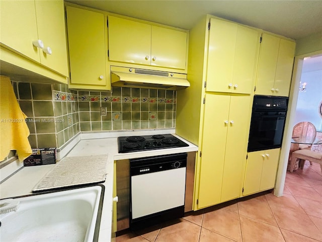 kitchen with decorative backsplash, white appliances, sink, and light tile patterned floors