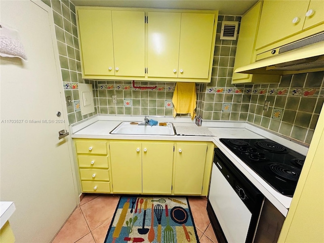 3301 NE 5th Ave Unit 110, Miami, FL 33137 - kitchen with under cabinet range hood, dishwasher, electric stovetop, light countertops, and light tile patterned flooring