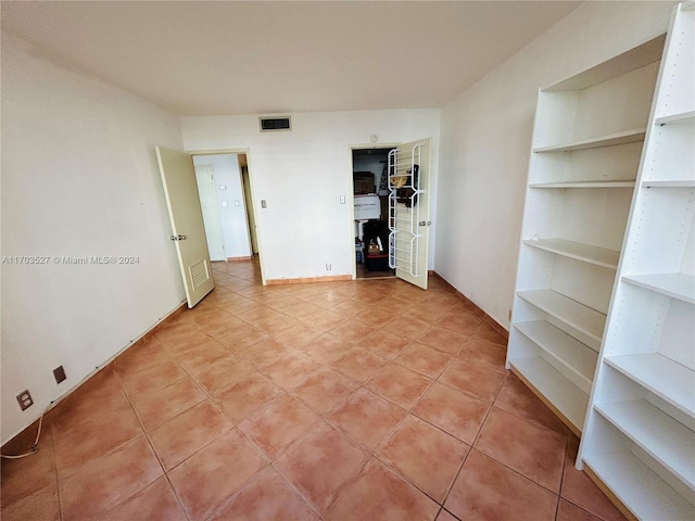 3301 NE 5th Ave Unit 110, Miami, FL 33137 - unfurnished room with built in features and light tile patterned floors