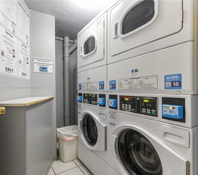 3301 NE 5th Ave Unit 110, Miami, FL 33137 - communal laundry room with stacked washer / drying machine, washer and dryer, and tile patterned floors
