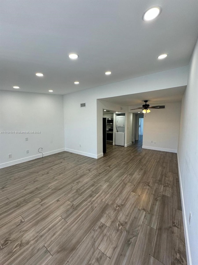 unfurnished living room featuring hardwood / wood-style floors and ceiling fan