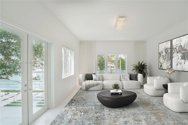 sunroom / solarium featuring french doors