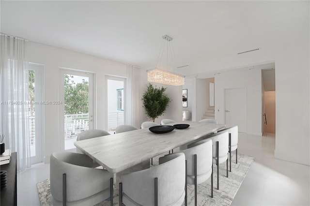 dining space featuring an inviting chandelier