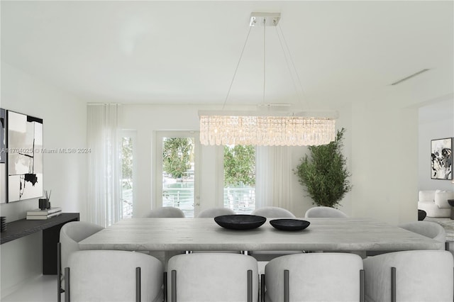 dining area with a notable chandelier