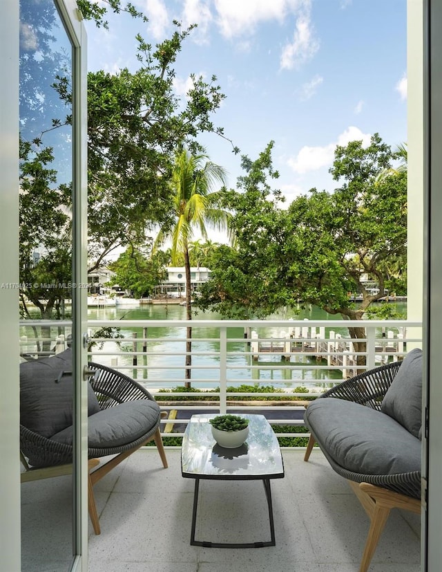 balcony featuring a water view