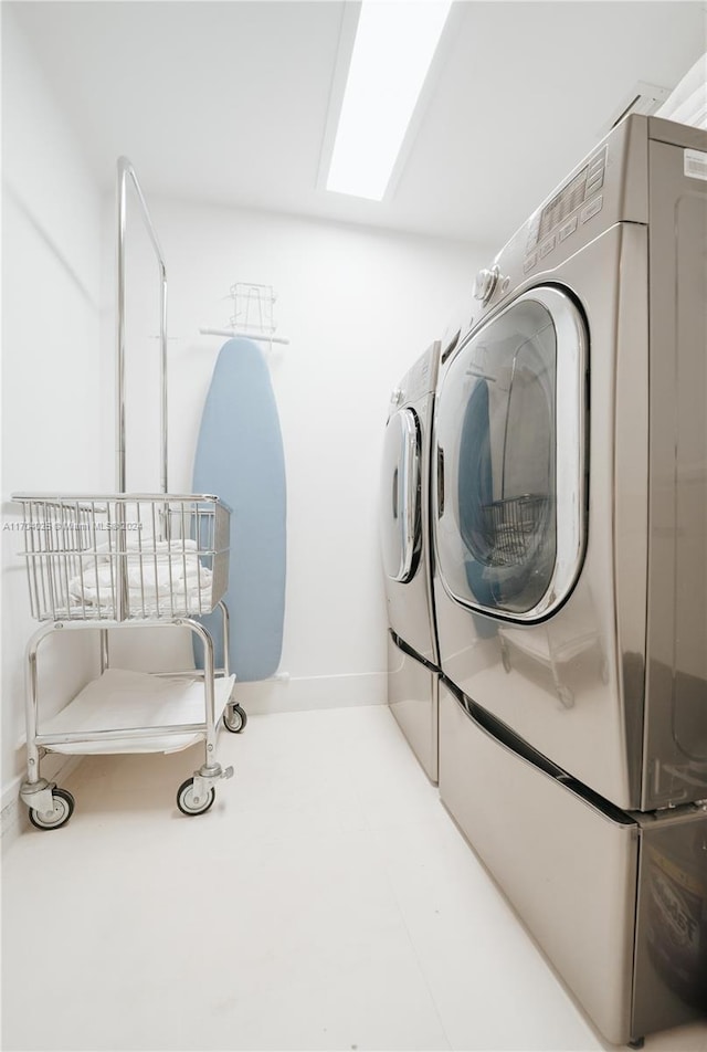 laundry room with washing machine and clothes dryer