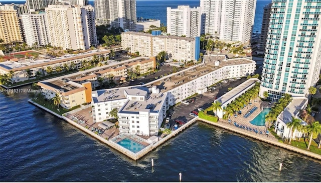 birds eye view of property featuring a water view