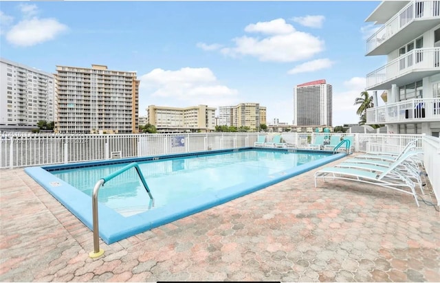 view of swimming pool with a patio area