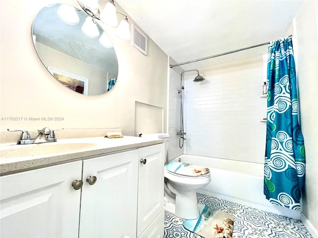 full bathroom with tile patterned floors, shower / bathtub combination with curtain, vanity, and toilet