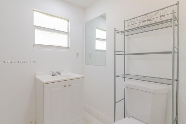 bathroom featuring vanity and toilet