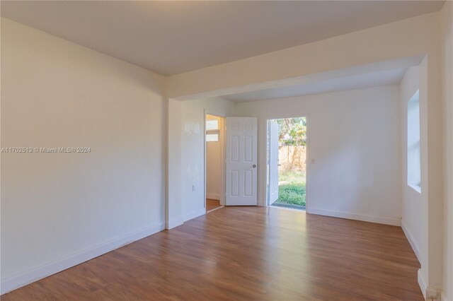 empty room featuring hardwood / wood-style flooring