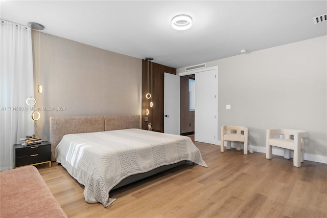 bedroom with light hardwood / wood-style floors