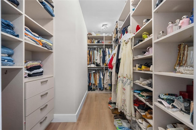 walk in closet featuring light hardwood / wood-style floors