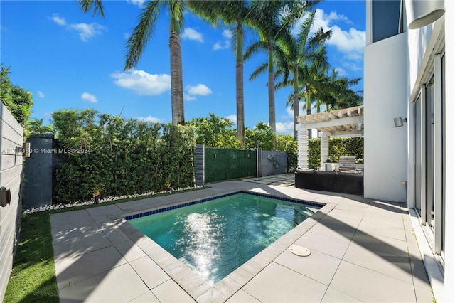 view of swimming pool featuring a pergola and a patio