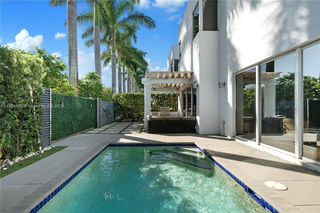 view of swimming pool featuring a pergola and a patio