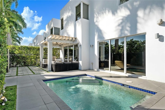 back of house with a pergola, a fenced in pool, and a patio