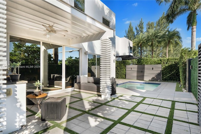 view of pool with a patio area, ceiling fan, and outdoor lounge area