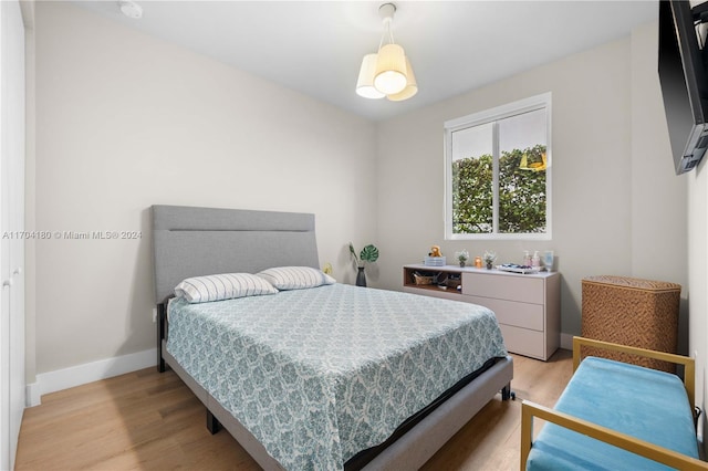 bedroom with light hardwood / wood-style floors