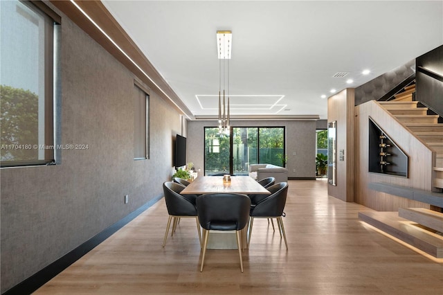 dining area with light hardwood / wood-style flooring