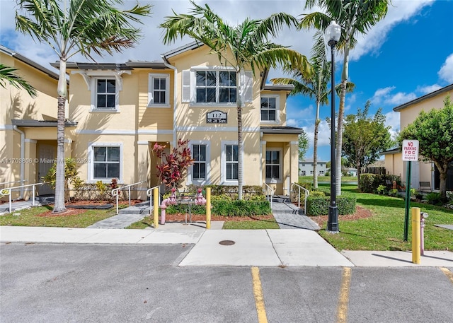 view of front of home with a front lawn