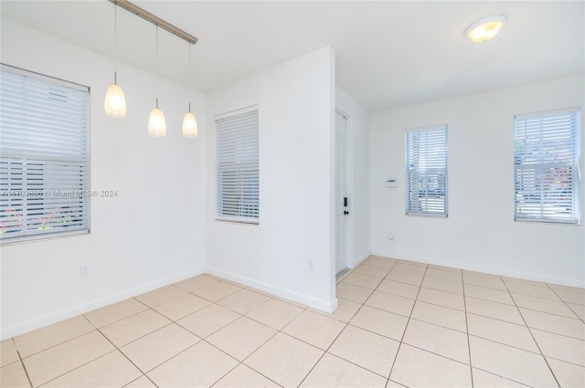 spare room featuring light tile patterned floors