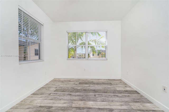 spare room featuring light wood-type flooring