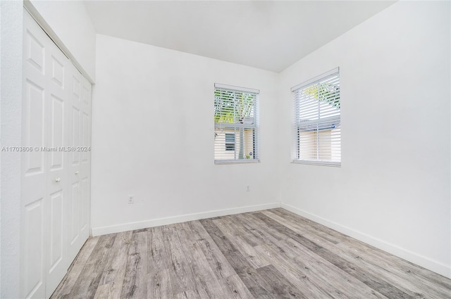 unfurnished room with light hardwood / wood-style flooring